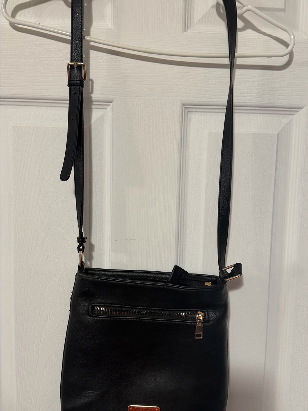 Sleek Black Crossbody Bag with Gold Accents